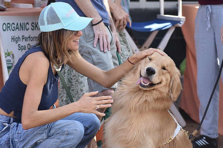 Ellie Petra enjoyed petting Max Solow's dog Finn.