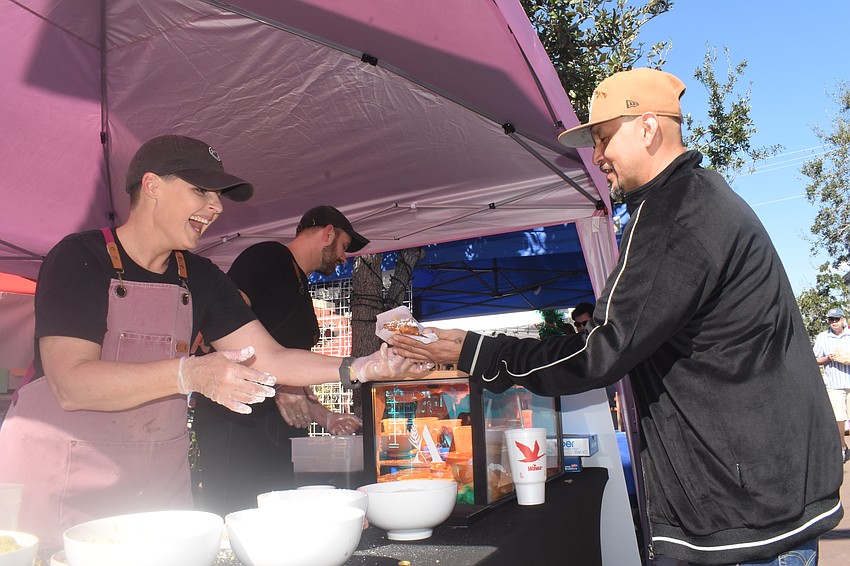 Amy Edwards, a baker, and Jim Angus, owner of Atria Bread+Coffee, prerpared customizable treats including the one Monico Ramirez prepares to enjoy.