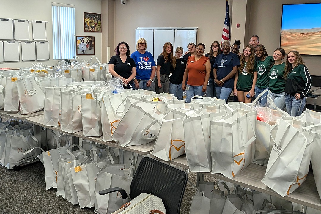 A record 75 Thanksgiving dinners distributed at Flagler Schools support staff's Gobble Event