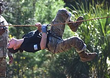 Marfil Trejo, the command sergeant major for the Braden River High Raiders, crosses the rope bridge at the Florida High School JROTC Raider State Championship on Nov. 15.
