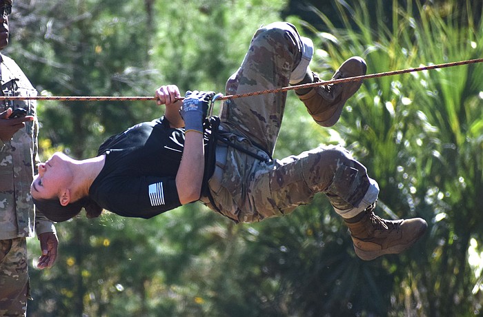 Marfil Trejo, the command sergeant major for the Braden River High Raiders, crosses the rope bridge at the Florida High School JROTC Raider State Championship on Nov. 15.