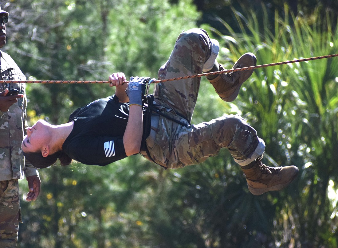 Marfil Trejo, the command sergeant major for the Braden River High Raiders, crosses the rope bridge at the Florida High School JROTC Raider State Championship on Nov. 15.
