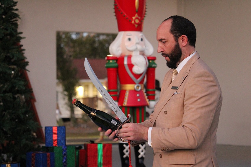 With the pop of a champagne cork and a dash of holiday magic from The St. Regis Longboat Key Resort's Peter Forsyth, the Christmas tree at the Town Center Green spark to life at Light Up Longboat.