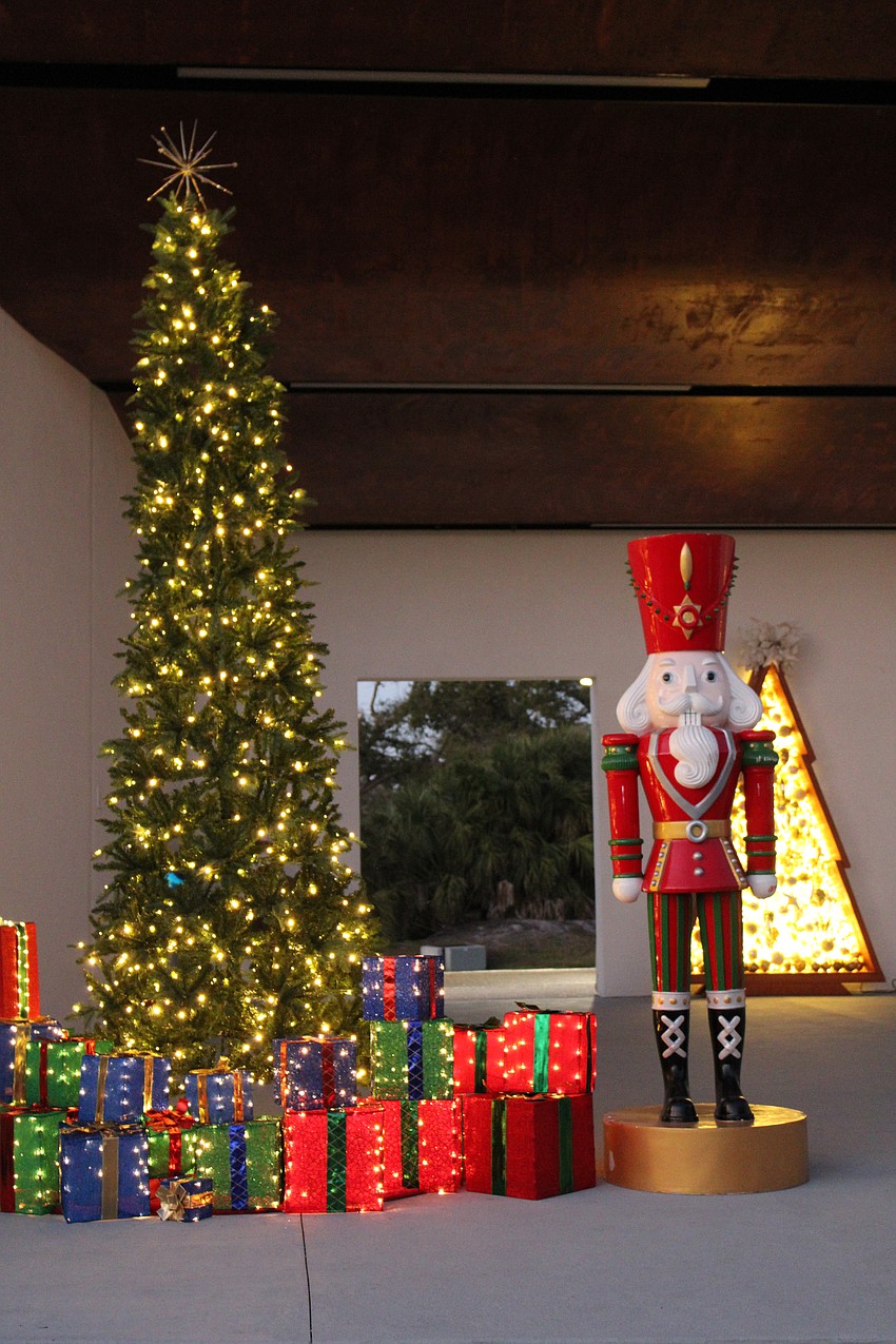 Choir members sang and families cheered as the lights came on at Light Up Longboat.