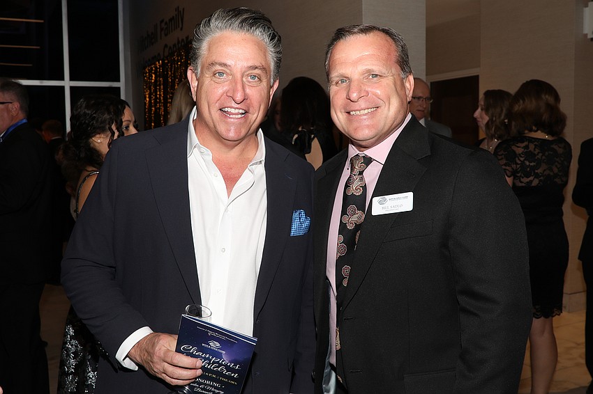 Glenn Rieth and Bill Sadlo enjoy cocktail hour.