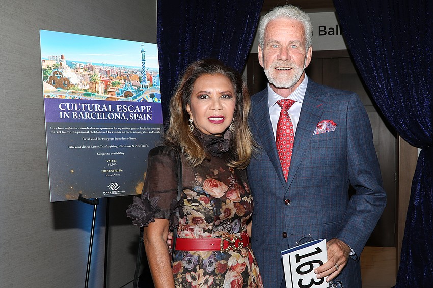 Evella and Keith Feldhacker enjoy a cocktail hour at Champions for Children.