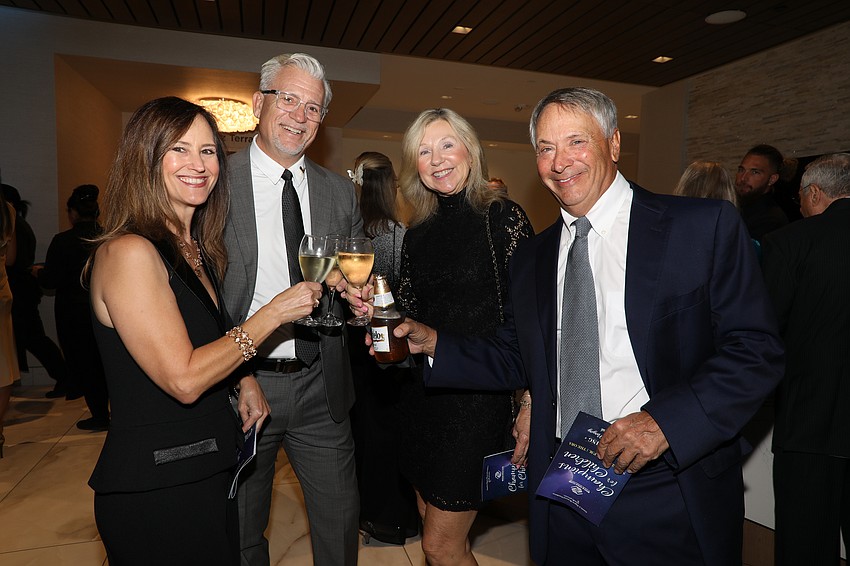 Cheers to Yvette and Dan Clermont and Ryndie and George Brusco.