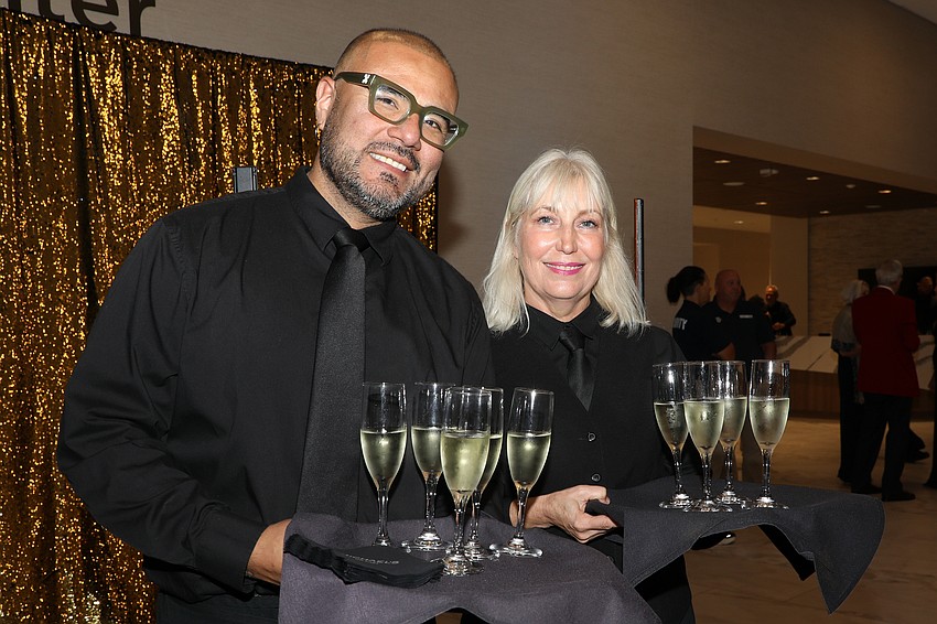 John Guerra and Renée Reedy from Michael's On East have over 300 glasses of champagne ready.