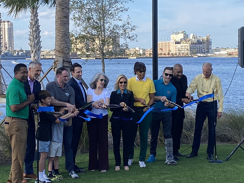 Jacksonville Mayor Donna Deegan, center, and other Council members and officials cut the ribbon Nov. 24 to celebrate the opening of the RiversEdge public parks on the Downtown Southbank. Jacksonville Mayor Donna Deegan, center, and other Council members and officials cut the ribbon Nov. 24 to celebrate the opening of the RiversEdge public parks on the Downtown Southbank.