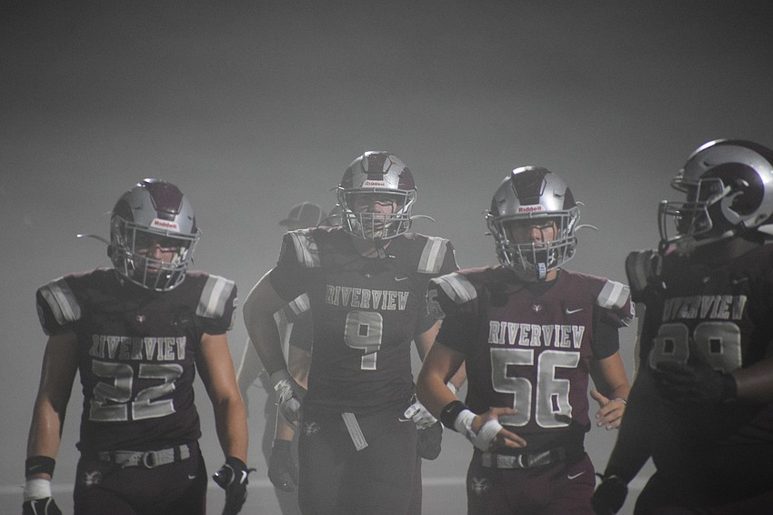 Miles Przekwas (9) emerges from the fog with his fellow Rams while returning to the sideline for a timeout. Starting at tight end, he was the only pass-catcher to score a touchdown for Riverview in its final game of the 2025 season.