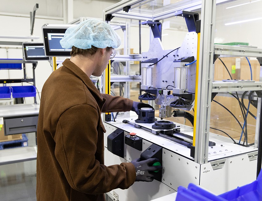 Gage Denson works in the manufacturing area within the 12,000-square-foot facility where Epic Water Filters is based in Palmetto.