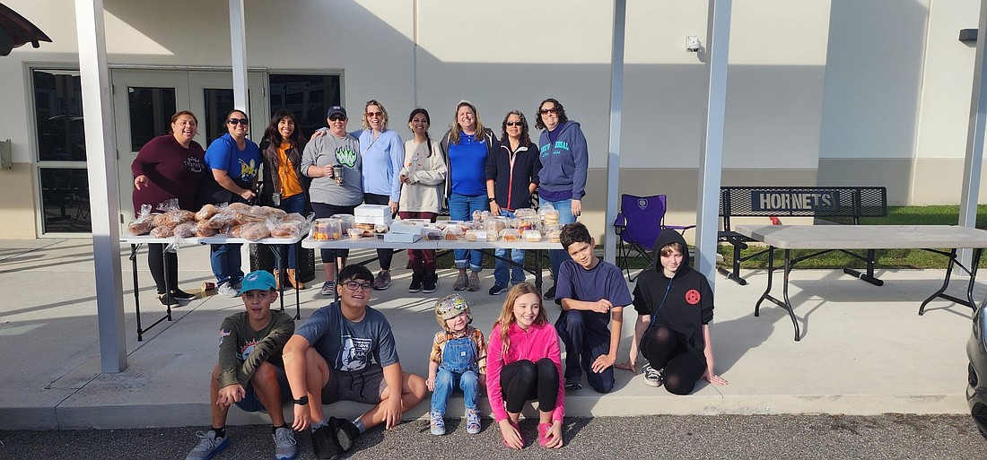 PTO members and students showed off the food they were able to collect from Publix.