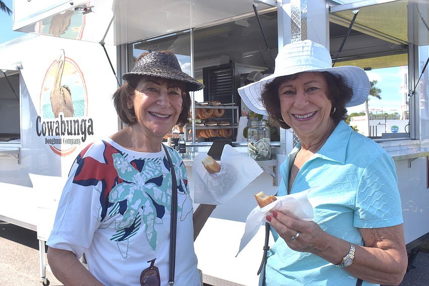 Sarasota's Lynn Joseph and Daytona Beach's Rachel Hachey enjoy a sweet treat from Cowabunga Doughnut Company.