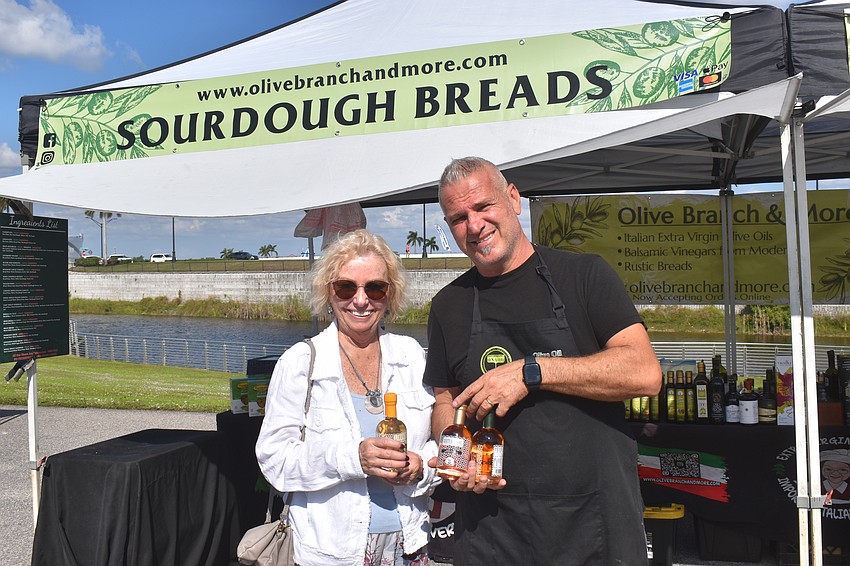 Sarasota's Lynn Harrison looks forward to using the lemon white balsamic on her salads that she purchased from Guseppe Testini, owner of Olive Branch & More.