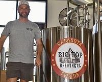 CEO Mike Bisaha says the new equipment will at least triple Big Top Brewing Co.'s beer production.