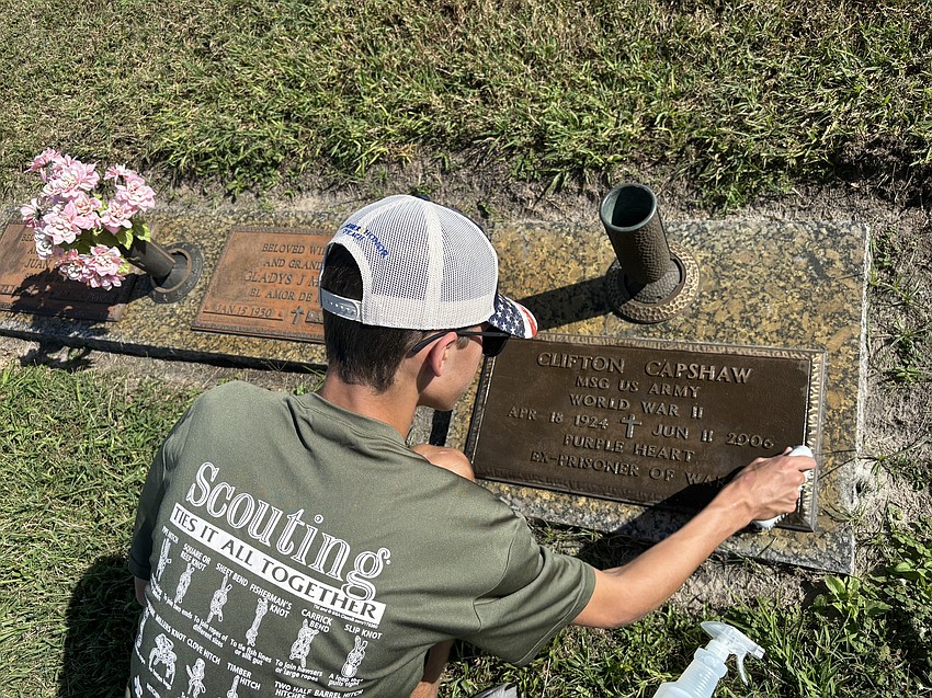 Ethan Tasior meticulously cleaned a veteran’s headstone as part of his Eagle Scout project.
