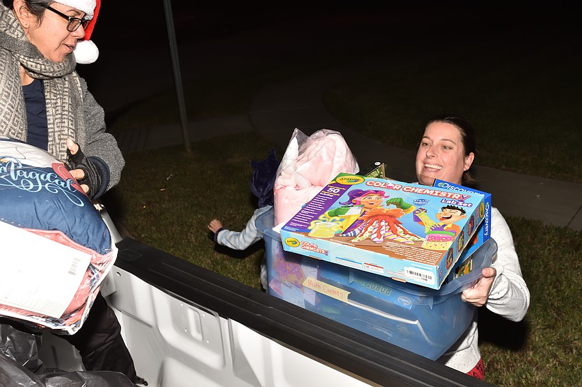 Ocoee residents donate toys to the Ocoee Police Department’s Holiday Toys for Kids in Need during Operation Santa.