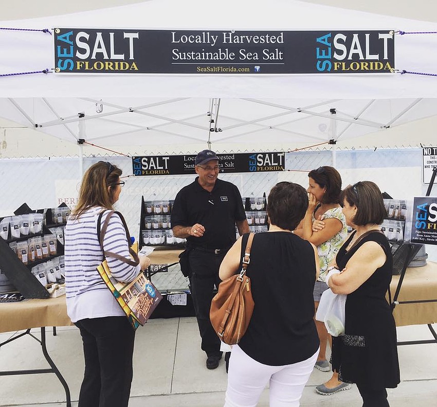 Tim Norwood speaks with customers.