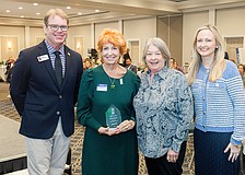 Mary Bensel, the executive director of the Van Wezel Performing Arts Hall, displays her award alongside John LaCivita, chief executive officer of Willis A. Smith Construction; Virginia Haley, the retired president and CEO of Visit Sarasota County and Erin Duggan, Visit Sarasota County's president and CEO.