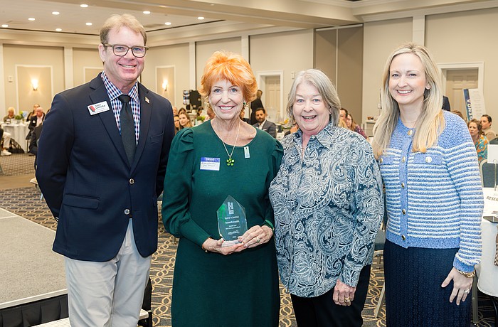 Mary Bensel, the executive director of the Van Wezel Performing Arts Hall, displays her award alongside John LaCivita, chief executive officer of Willis A. Smith Construction; Virginia Haley, the retired president and CEO of Visit Sarasota County and Erin Duggan, Visit Sarasota County's president and CEO.