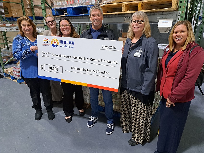 Amy Rugg, Community Impact Committee Member, CF/UWVFC; Rosana Colev, VITA Coordinator, CF/UWVFC; Courtney Edgcomb, President & CEO, CF/UWVFC; Robert Thomas, Branch Director, Second Harvest Food Bank of Central Florida; Denise O’Toole Kelly, Community Investments Assistant Director, CF/UWVFC; and Amanda Lasecki, VP of Operations, CF/UWVFC. Courtesy photo Amy Rugg, Community Impact Committee Member, CF/UWVFC; Rosana Colev, VITA Coordinator, CF/UWVFC; Courtney Edgcomb, President & CEO, CF/UWVFC; Robert Thomas, Branch Director, Second Harvest Food Bank of Central Florida; Denise O’Toole Kelly, Community Investments Assistant Director, CF/UWVFC; and Amanda Lasecki, VP of Operations, CF/UWVFC. Courtesy photo