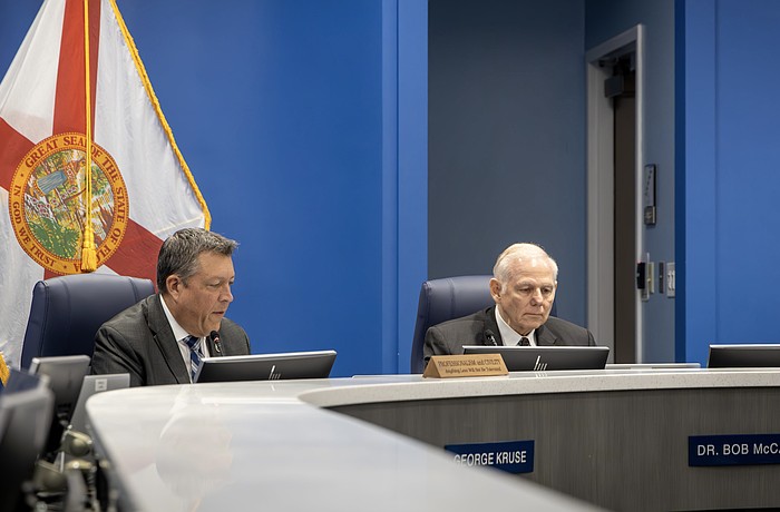 Commissioners George Kruse and Bob McCann are on opposite sides of the AAA High School vote. Kruse voted in favor of approving the site plan, and McCann voted to deny the site plan.