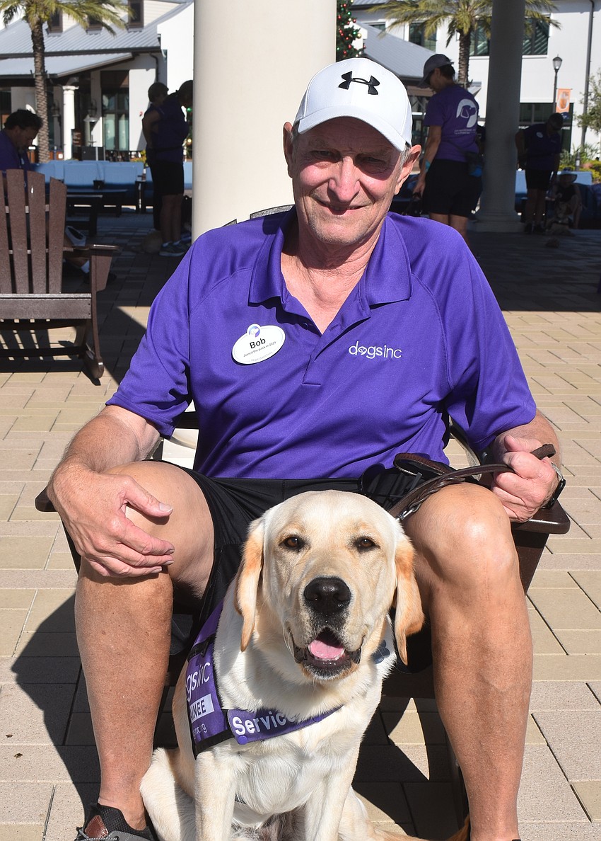 Bob Kasperski has had a hand in raising five different dogs, including his current dog Coach, a 10-month-old lab.