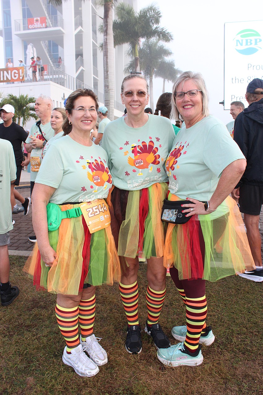 Lakewood Ranch's Claire Weaver, Greyhawk Landing's Stephanie Oake, and Sarasota's Joni Citron dress the part for the Florida Turkey Trot.