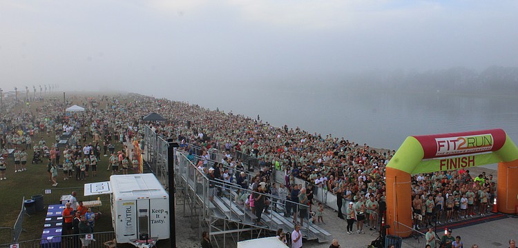 Runners pack the starting area for the 2025 Florida Turkey Trot Nov. 27 at foggy Nathan Benderson Park. The race had a record 4,558 participants.