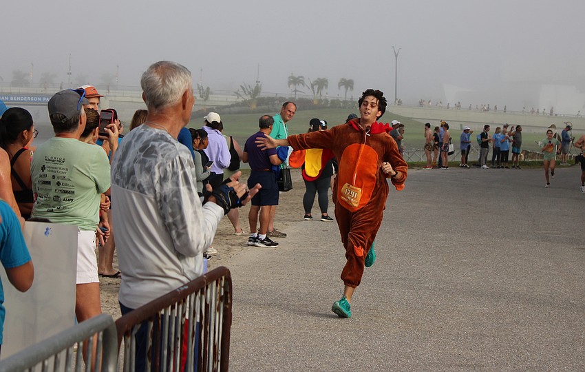 Sarasota's Jake Grewal was the first fully-costumed turkey to finish the 2025 Florida Turkey Trot at Nathan Benderson Park Nov. 27.