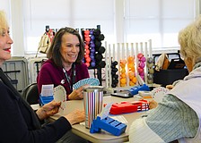 American Contract Bridge League-certified bridge player Patty Mayer checks out her hand while playing a round at the club's new meeting spot at the Bayfront Park Recreation Center.