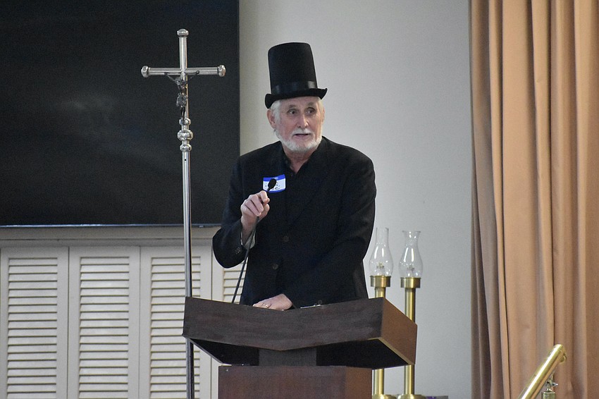 Jon Thaxton, director of policy and advocacy at Gulf Coast Community Foundation, once again performs the annual tradition of addressing attendees as Abraham Lincoln.