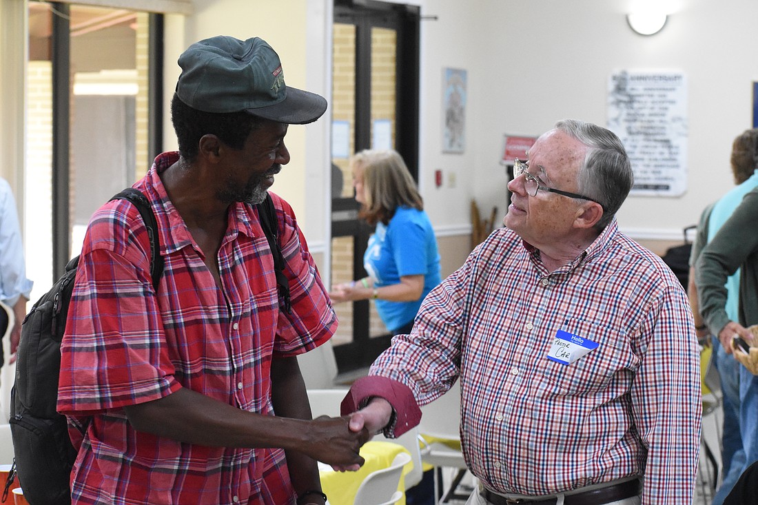 Lyndon Usher speaks with Pastor Carl Jenks of Radiance Church of Sarasota.