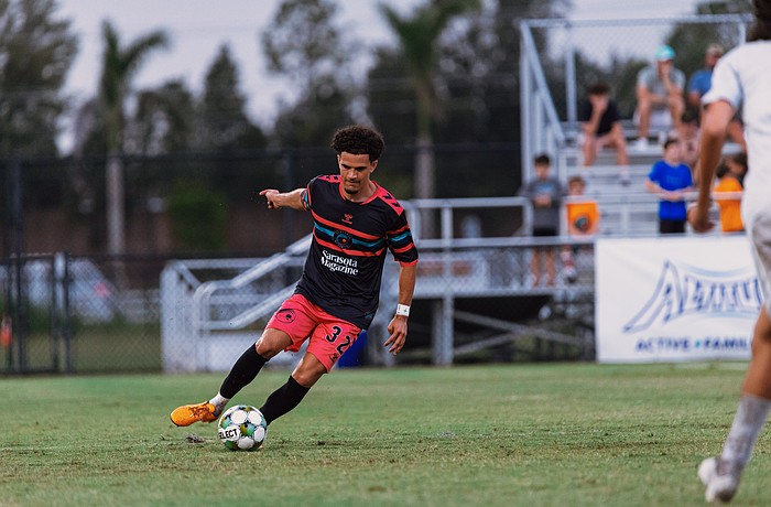Roberto Burlew dribbles down the turf at Premier Sports Campus in Lakewood Ranch. The Sarasota Paradise signed the defender to their roster ahead of the team's first professional season in USL League One.