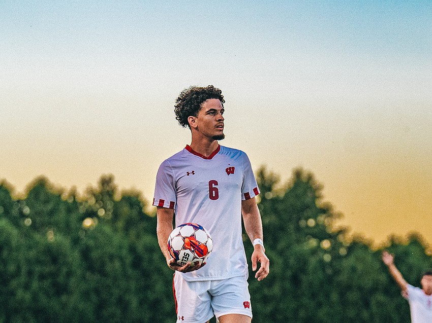 Roberto Burlew eyes the field before a throw-in during a game with Wisconsin men's soccer. During his lone season with the Badgers, the then-graduate student defender logged a team-high in minutes back in 2024.