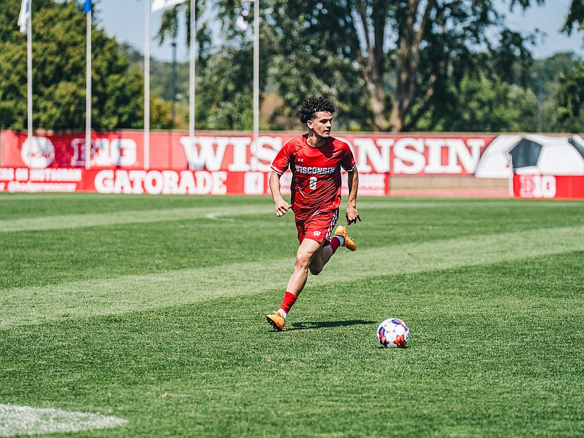 Roberto Burlew shifts his focus downfield before taking possession of the ball. While contributing four assists for Wisconsin during the 2024 season, he also had a season-high three shots on goal against UCLA on Sept. 16 of that year.