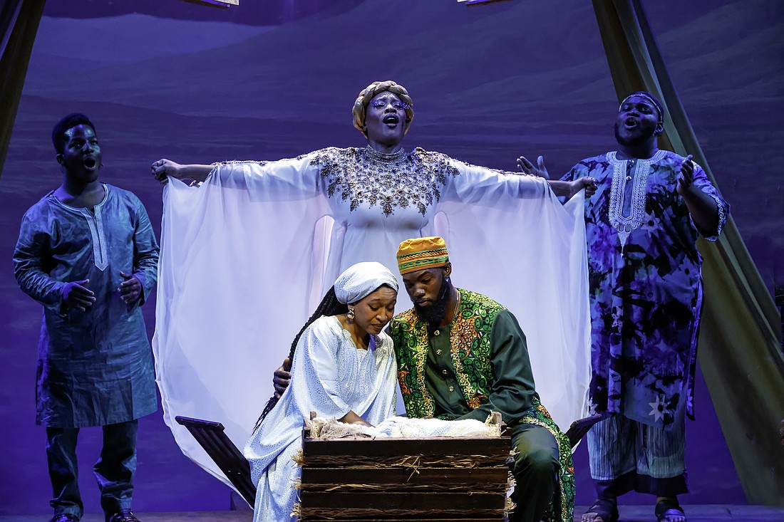 Stephanie Zandra plays the Archangel who looks down over Joseph (Eustace Williams) and Mary (Maicy Powell) in Westcoast Black Theatre Troupe's "Black Nativity," which runs through Dec. 21.
