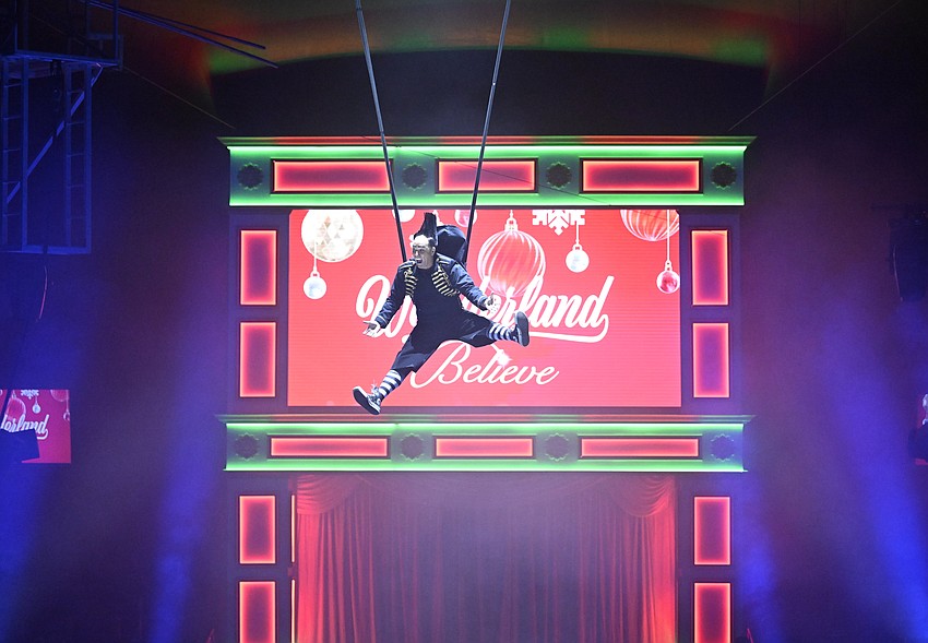 Daredevil clown Johnny Rockett wows the crowd in Nik Wallenda's holiday circus, 