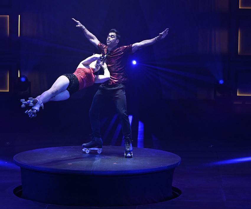 It's wheels up for roller skaters Royer Segura-Calderon and Emelie Sandberg of Sweden, who perform at Nik Wallenda's holiday circus, 