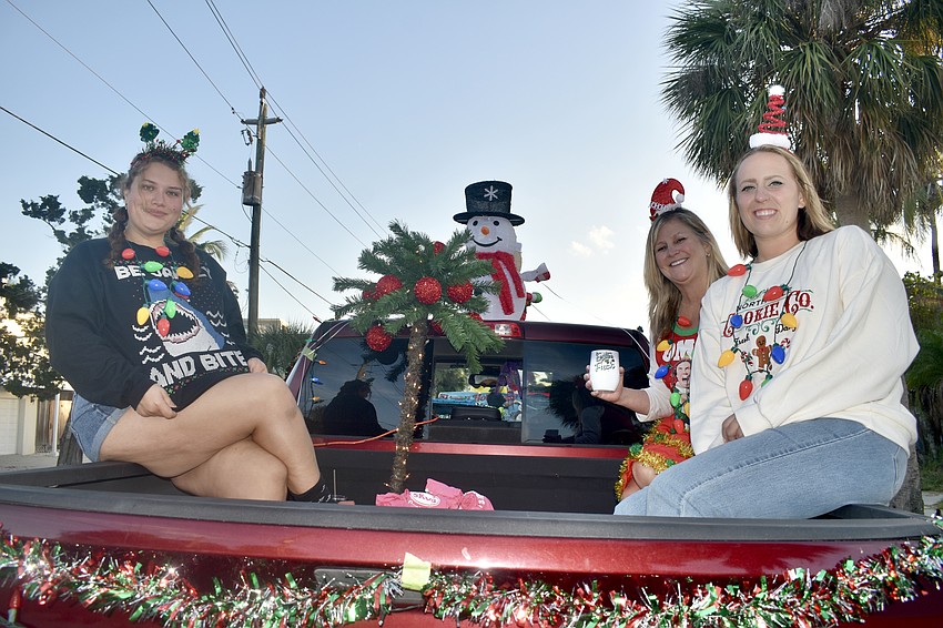 Juliet Perry, Kelly Hollingsworth and Paige Houser prepare to ride with Siesta Key Oyster Bar.