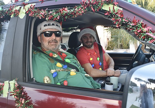 Siesta Key Oyster Bar co-founder Geno Pedigo, and Zach Steffen, prepare to ride out.