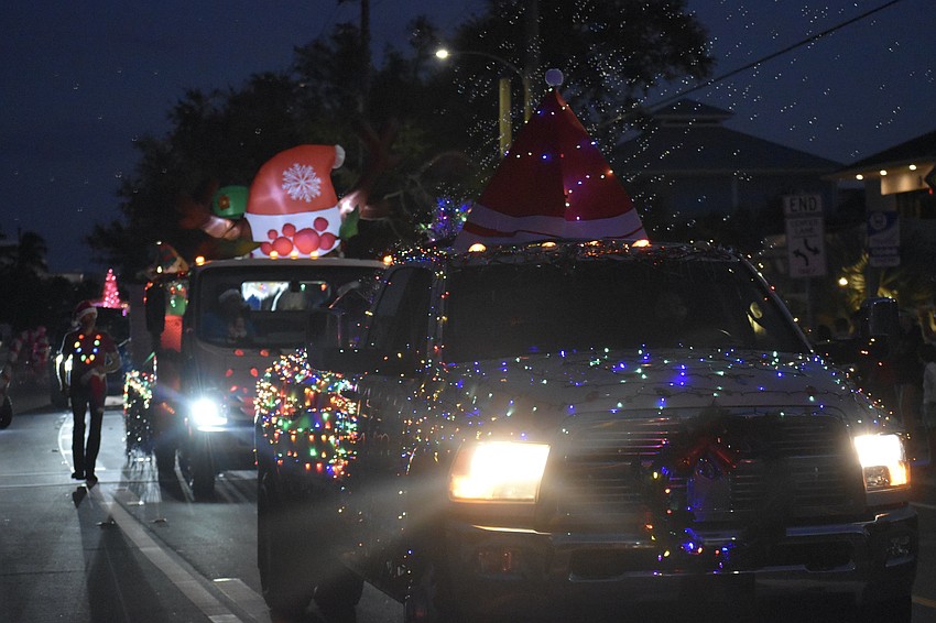 Vehicles make their way along the parade route.