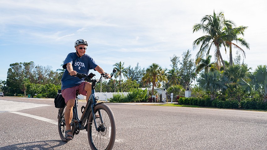 Mike Graham rides his bike from the Rosemary District in Sarasota, over the Ringling Causeway Bridge and to Longboat Key, a trip he wouldn’t take if he didn’t have his pedal-assist e-bike.