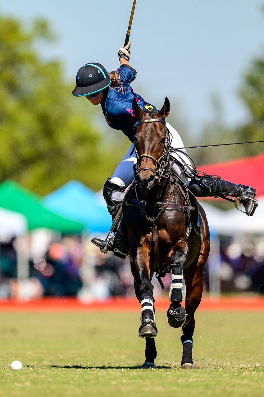 Maddie Grant brings back her mallet before striking the ball during a match at Sarasota Polo Club.
