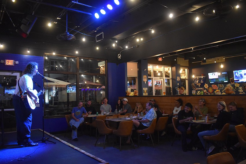 Harris Pierce entertains the crowd with improvised songs about dating fictional monsters.