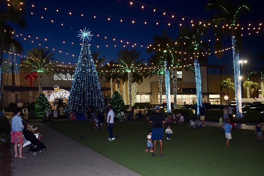 Even without a scheduled event, families are gathered on The Green at UTC Nov. 30.