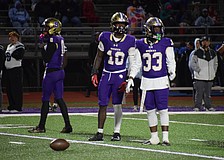 Kevontay Hugan (10) and Le'Darien Smith (33) look to their sideline before a play during the regional final between Booker and Nature Coast Tech. The two seniors are part of a Tornado defense which has allowed only three touchdowns in its last six games.