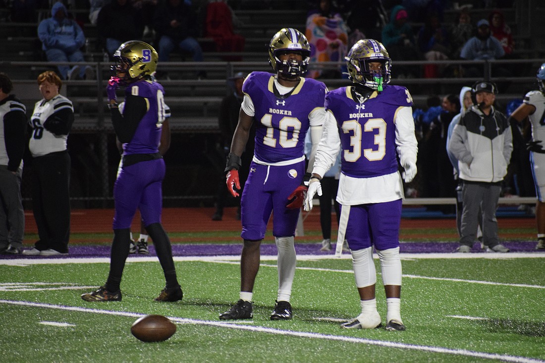 Kevontay Hugan (10) and Le'Darien Smith (33) look to their sideline before a play during the regional final between Booker and Nature Coast Tech. The two seniors are part of a Tornado defense which has allowed only three touchdowns in its last six games.