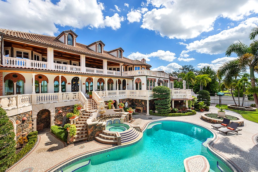 Terraces overlook the bay and the property’s resort-style pool.