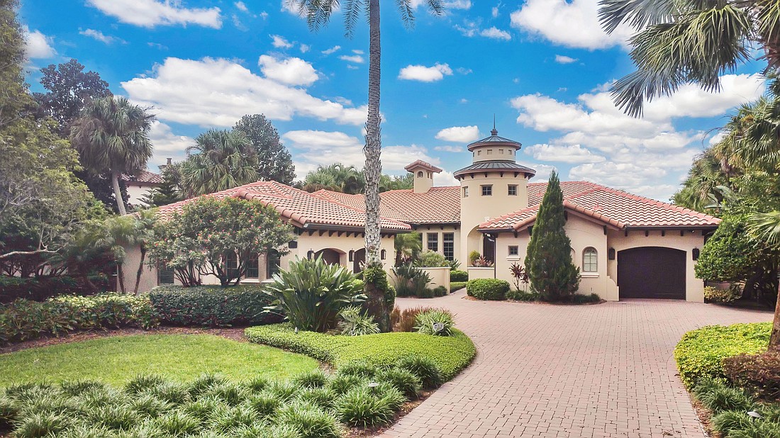 The home at 9310 Isleworth Gardens Drive, Windermere, sold Nov. 26, for $3,550,000. A cast stone fireplace anchors the living room, while the family room opens through panoramic sliding doors to a covered lanai, creating a seamless indoor-outdoor experience. The sellers were represented by Linnae Williams, Sundance Group Realty.